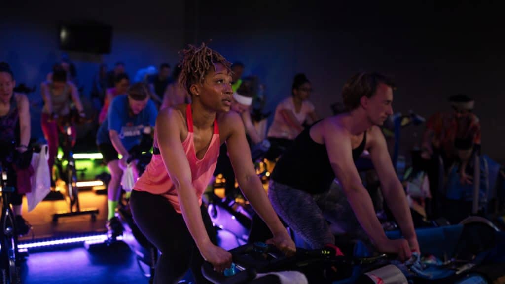 Men and women at a spin class