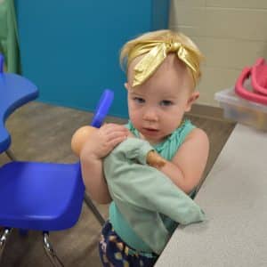 A toddler playing at the YMCA.