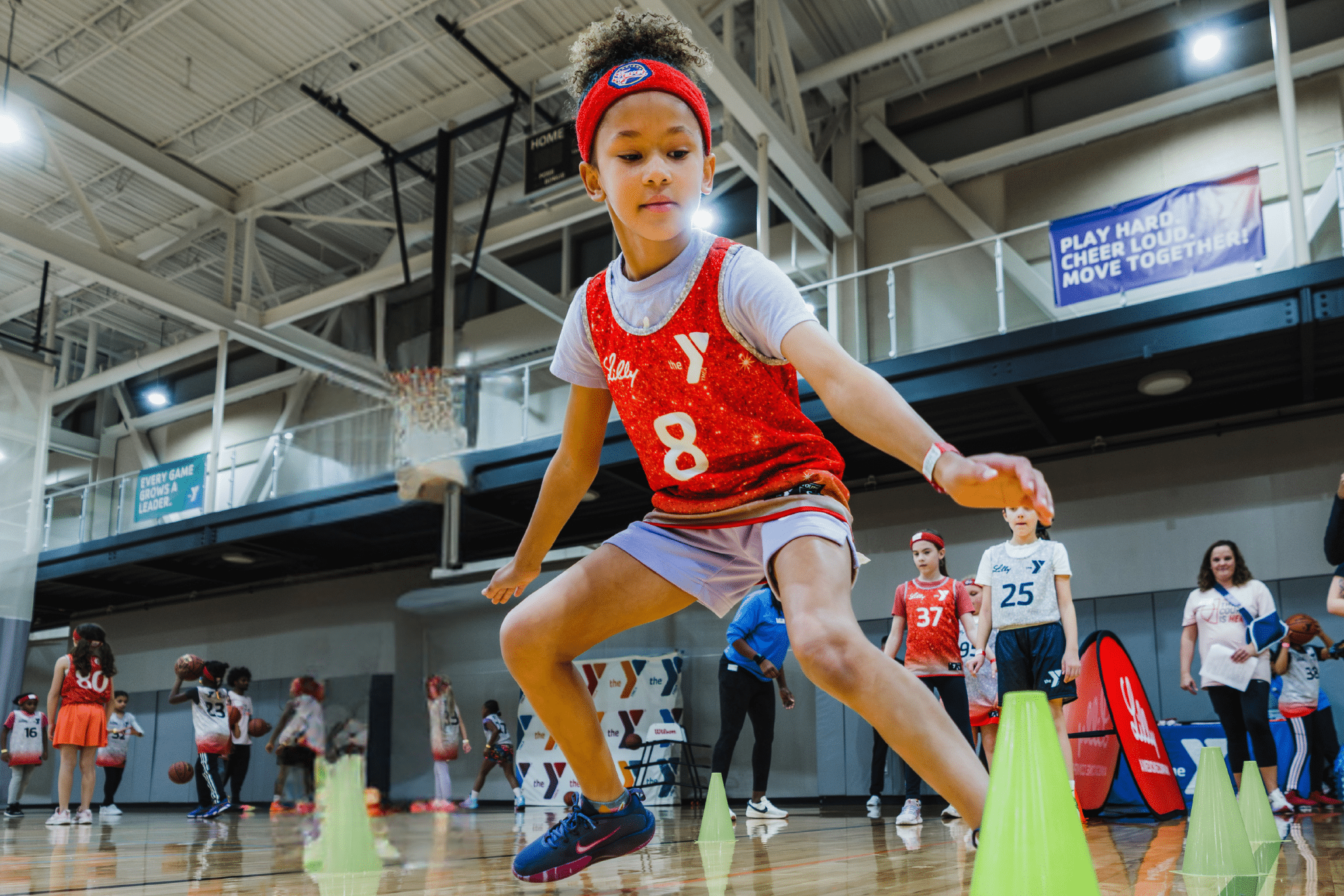 Girls playing at a YMCA basketball clinic