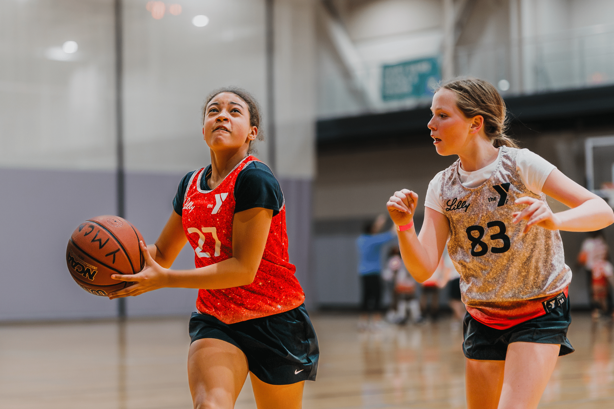 Girls playing in YMCA basketball leagues.