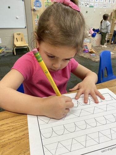 Girl Writing in Daycare
